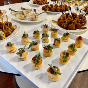 Assorted hors d’oeuvres served at Reston National Golf Course, featuring bite-sized appetizers arranged on a platter for events and social gatherings.